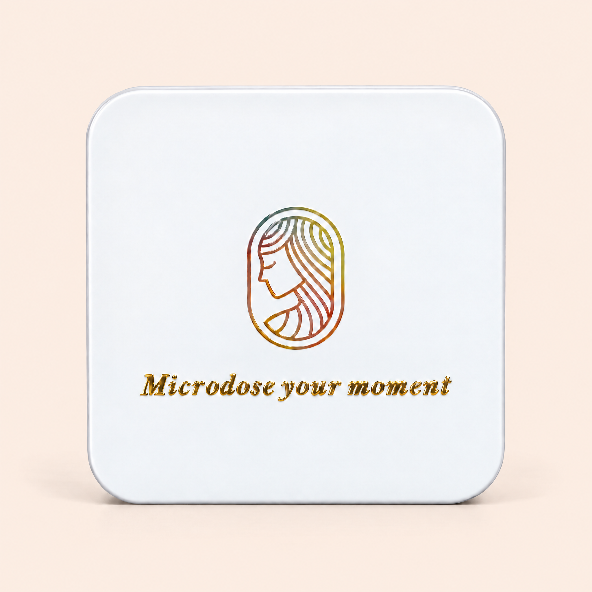 A square white metal tin with rounded corners, featuring a gold and multicolor line-art logo of a woman's profile and the text 'Microdose your moment' on the lid. 