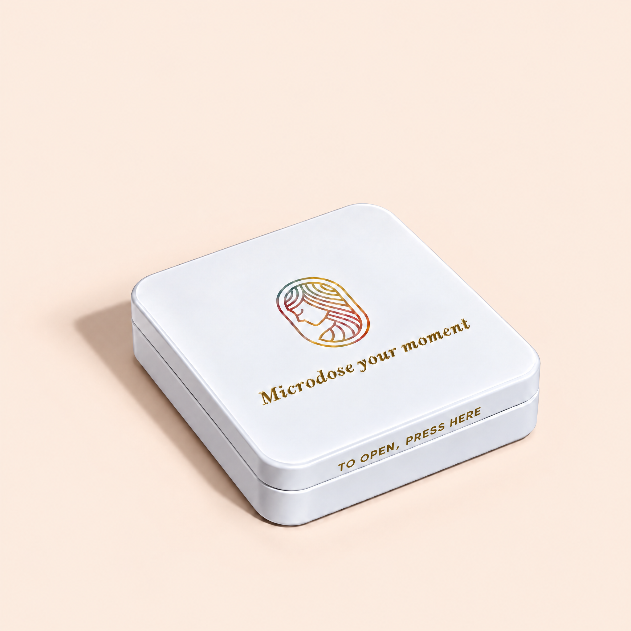 A square white metal tin with rounded corners, featuring a gold and multicolor line-art logo of a woman's profile and the text 'Microdose your moment' on the lid. The bottom edge of the lid also reads 'TO OPEN, PRESS HERE'.